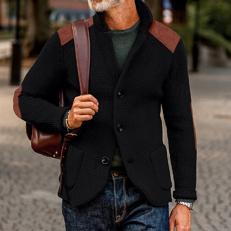 Mens cardigan with stand collar and shoulder patches, shown in black
