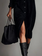 Womens corduroy shirt dress in Black, close view of the front slit